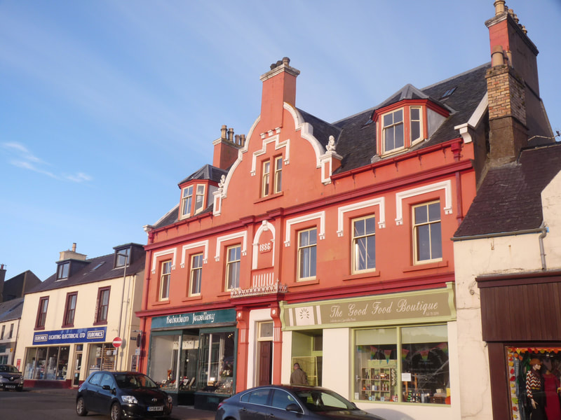 Colourful shops line the waterfront in Stornoway, the largest town in the Outer Hebrides with around 8,000 residents.