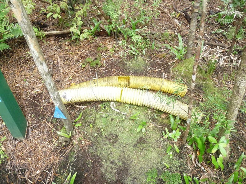 Old style but very effective poison bait stations made from drainage coil.